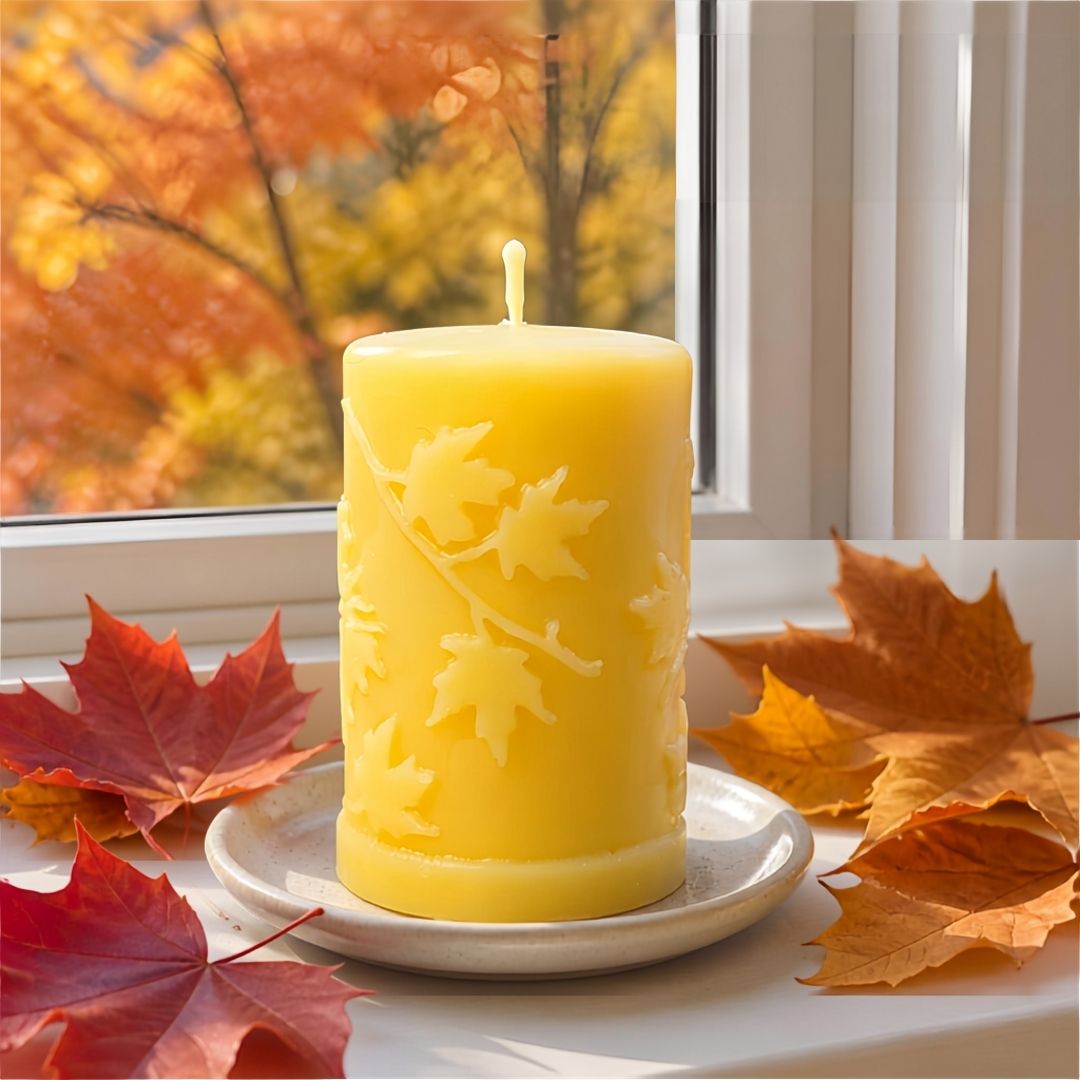 'Autumn Leaves' 100% pure beeswax pillar candle with raised fall leaf design, 2.5 x 4 inches, from Big Moon Beeswax