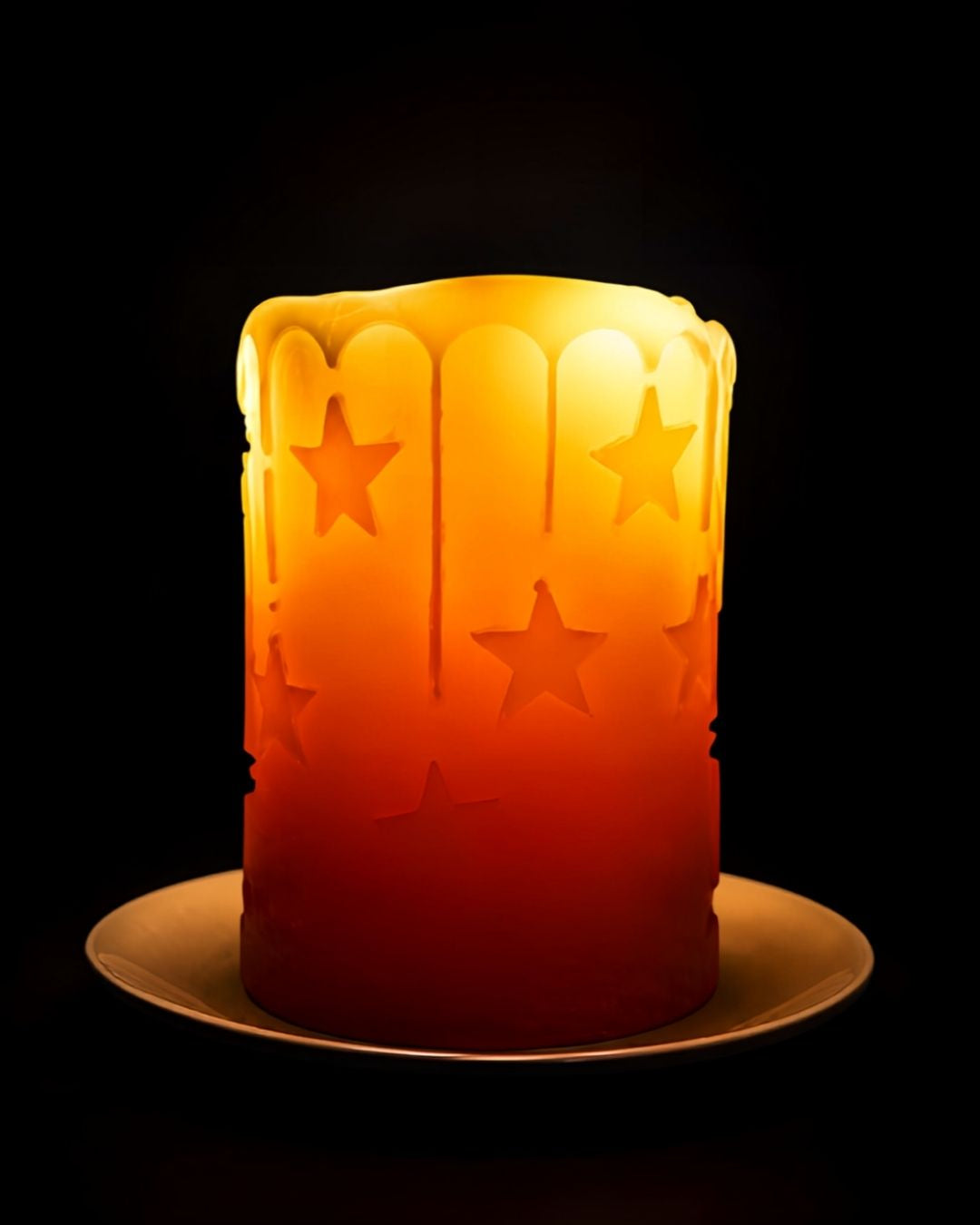 'Starry Starry Night' beeswax pillar candle, lit, stars glowing