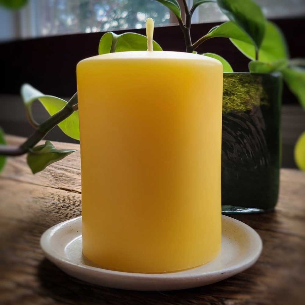 'Timeless' smooth beeswax pillar candle, lit