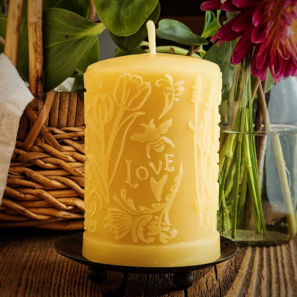 'Into the Garden!' beeswax pillar candle, lit