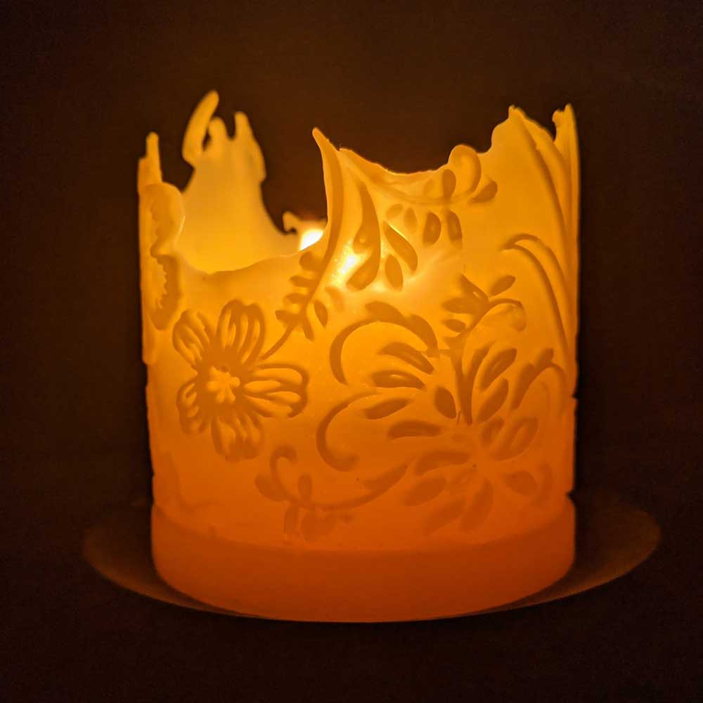'Into the Garden!' beeswax pillar candle, detail of the bee design